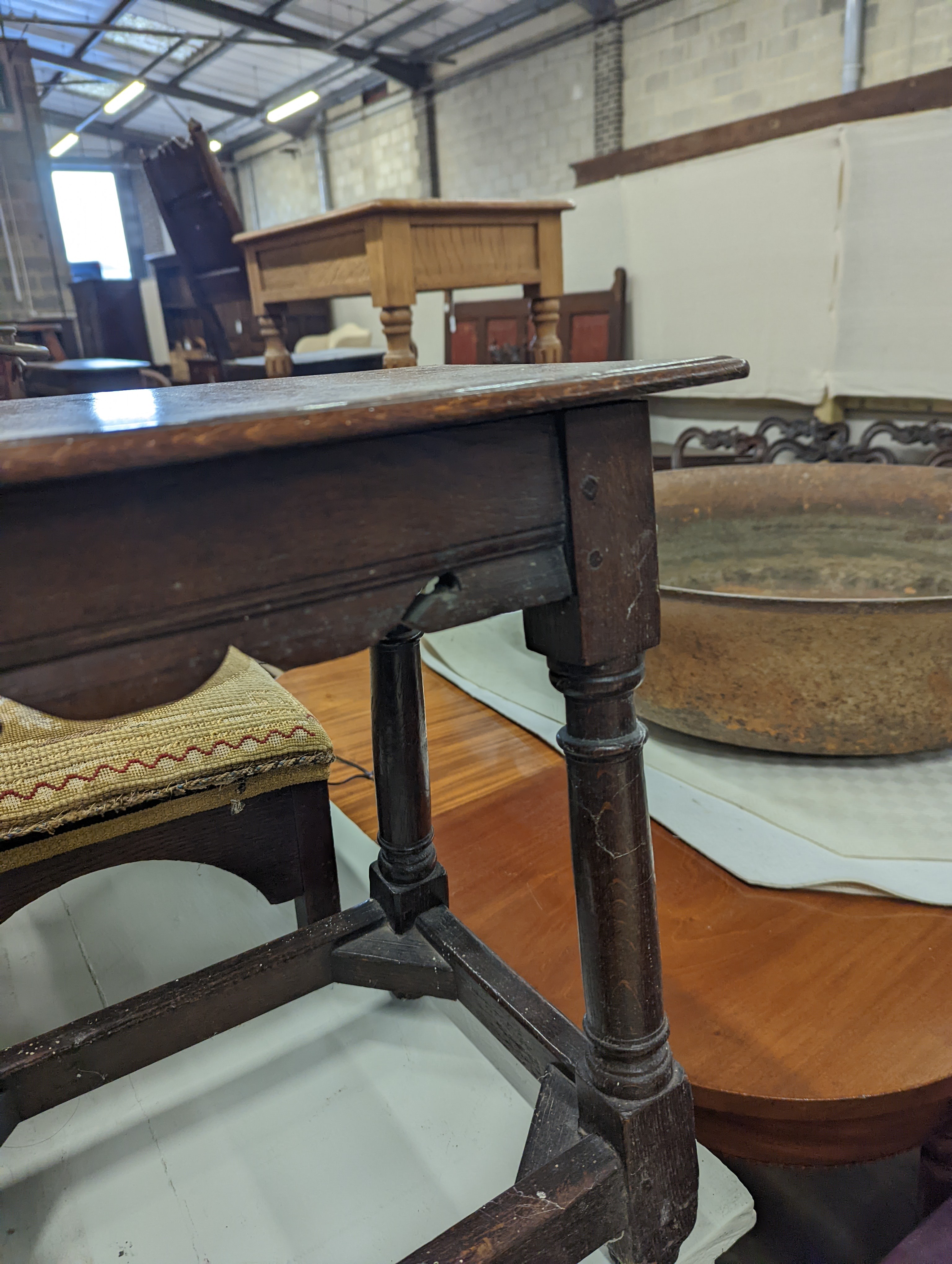 A 17th century style oak joint stool, width 46cm, depth 26cm, height 46cm and a George III stool with Victorian needlework seat, length 33cm